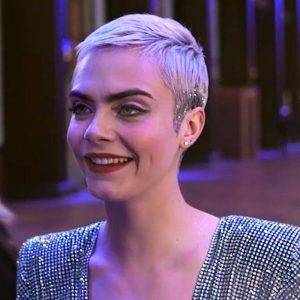 A woman with short hair smiling