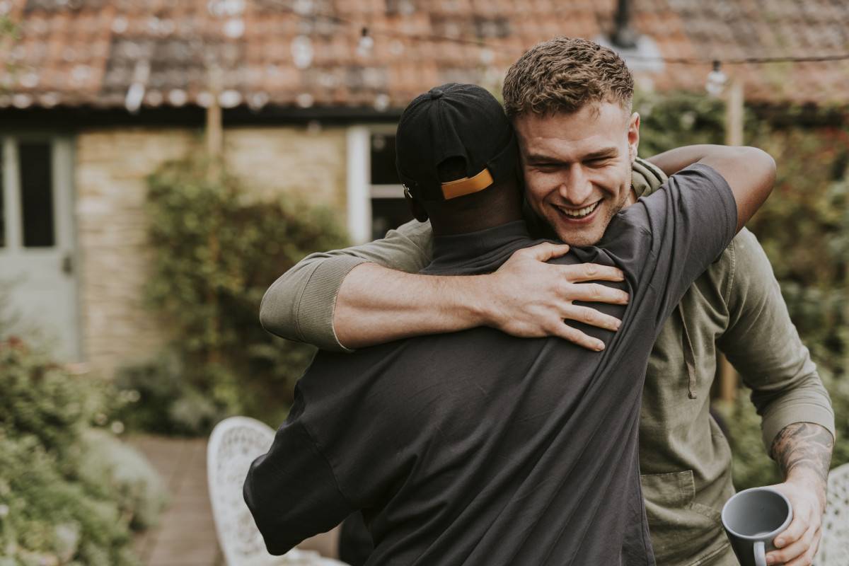 Photo of two men hugging