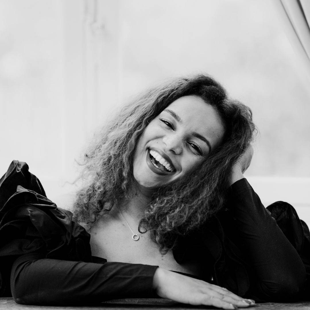 A headshot of Catherine Joy White smiling.